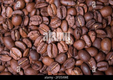 close up Freshly roasted coffee beans background. top view. Stock Photo