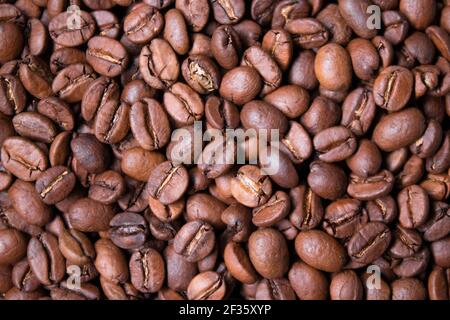 close up Freshly roasted coffee beans background. top view. Stock Photo