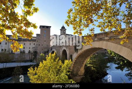 Italy, Rome, Tiber river, Isola Tiberina, Pons Fabricius bridge in autumn Stock Photo
