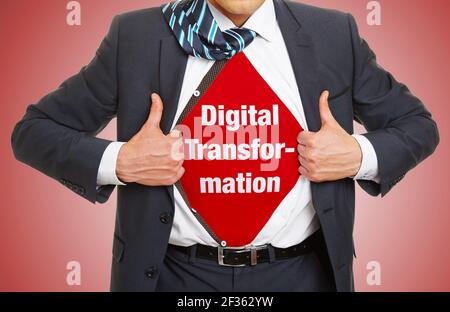 Man in suit opens shirt and wears lettering Digital Transformation underneath as digitization concept Stock Photo