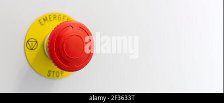 The red button of machine emergency stop on grey backround. Copy space. Stock Photo