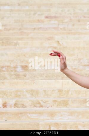 fragment photo of elegant woman hand with red nails. Skin care concept. Beauty. Red bails. Elegance Stock Photo