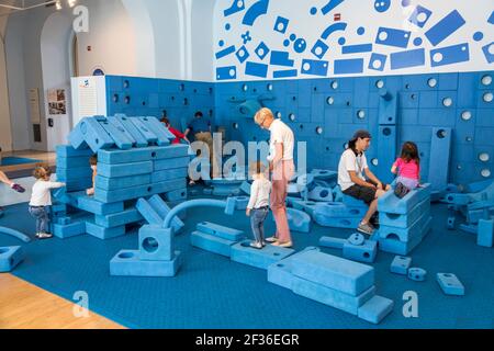 Washington DC,National Building Museum Pension Building,exhibit Building Zone hands-on children's play area playing,building blocks boy boys male kid Stock Photo