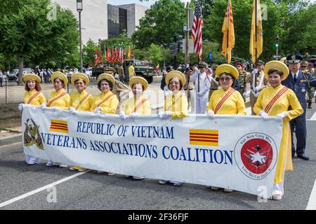 Washington DC,National Memorial Day Parade,Vietnam Veterans Associations Coalition banner,Asian women wearing traditional dress, Stock Photo