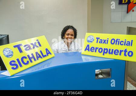 Santo Domingo Dominican Republic,Las Américas International Airport SDQ,Hispanic woman female ground transportation taxi service counter sign employee Stock Photo