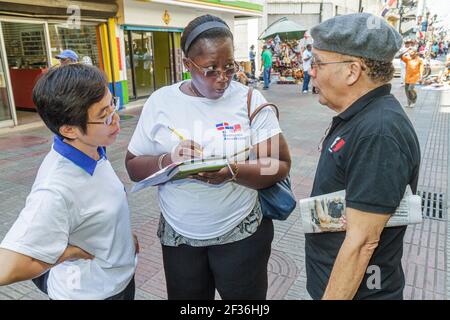 Santo Domingo Dominican Republic,Ciudad Colonial Calle el Conde Peatonal,pedestrian mall survey questionnaire Black Hispanic woman female interviews i Stock Photo