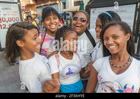 Santo Domingo Dominican Republic,Ciudad Colonial,Calle el Conde Peatonal pedestrian mall,Hispanic Black students girls teens teenagers friends smiling Stock Photo