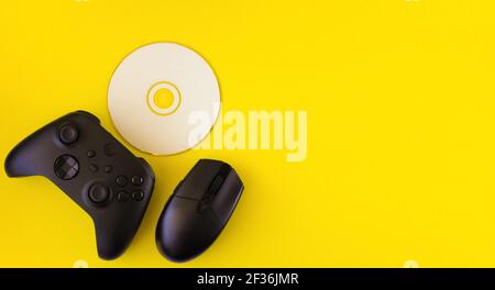 Gamer flat lay. Gaming accessories on yellow background with copy space.Gamer gadgets.  Stock Photo
