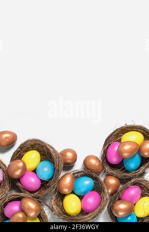 Colorful Easter eggs in nests. Stock Photo