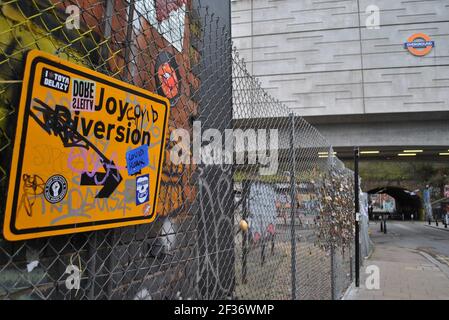 Subverted sign that reads Joy Diversion, a pun on the name of the band Joy Division. A few other stickers have been added also. Stock Photo