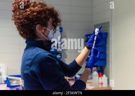 Coria, Spain. 15th Mar, 2021. A healthcare worker prepares a syringe with the Astra Zeneca Covid19 dose at Coria City Hospital. Some European countries have cancelled the administration of AstraZeneca vaccine due the appearance of some side effects in people who had received it recently. (Photo by Gustavo Valiente/SOPA Images/Sipa USA) Credit: Sipa USA/Alamy Live News Stock Photo