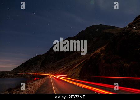 Traffic trails at night, Snowdonia, North Wales Stock Photo
