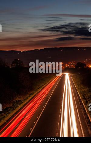Traffic trails at dusk, North Wales Stock Photo