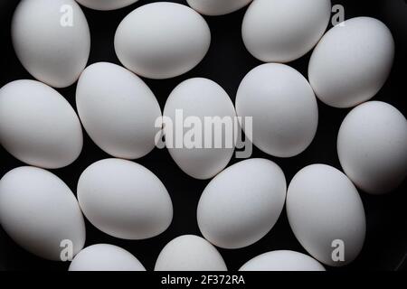 Organic eggs on a black background