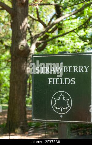 Sign to Strawberry Fields - section of Central Park memorializing John Lennon, New York City, USA Stock Photo