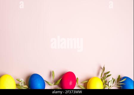 Multi-colored Easter eggs. Yellow, pink and blue. Minimal concept Stock Photo