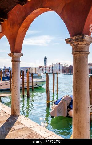 Murano lighthouse from the arcades of Fondamenta Navagero Andrea in Murano in Venice in Veneto, Italy Stock Photo