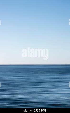 Abstract of sea and sky, blurred using intentional camera movement Stock Photo