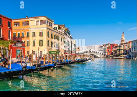 Gondolas with tourists sail on a canal in Venice, Veneto, Italy Stock Photo