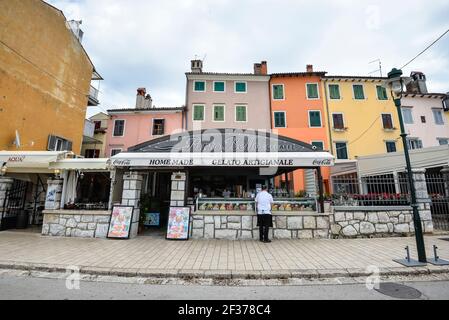 Rovinj, Croatia - May 22, 2020: View on bright building exteriors of Coastal town of Rovinj, Istria, Croatia. Rovinj - beautiful antique city. Cororfu Stock Photo