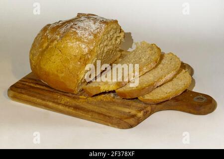 Sliced white bread in a cutting board Stock Photo