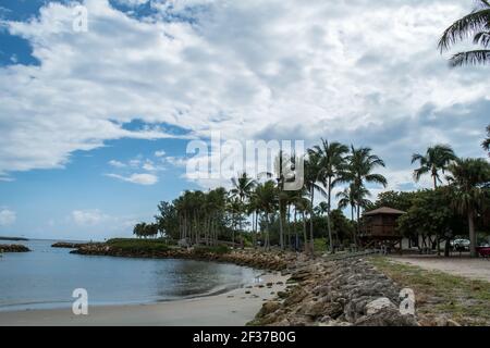 Marina and park with palm trees, grass, water in Palm Beach County, Florida part of the Florida Fish and Wildlife with sidewalk, boardwalks and bridge Stock Photo