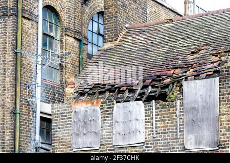 Old building with damaged, dilapidated roof Stock Photo