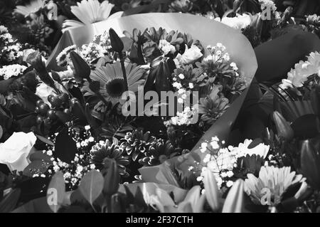 Flower bouquets background. Sadness concept. Black white photo. Stock Photo