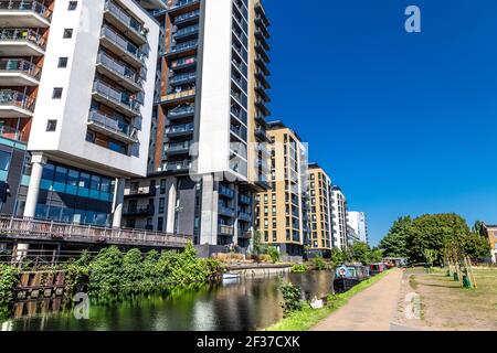 New-build residentail tower clocks along the Regent's Canal in Mile End, London, UK Stock Photo