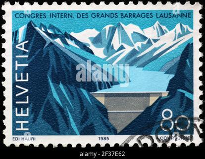 Mountain dam on swiss postage stamp Stock Photo