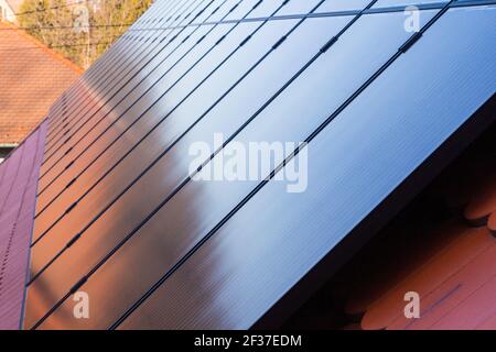 Solar panels installed on roof Stock Photo