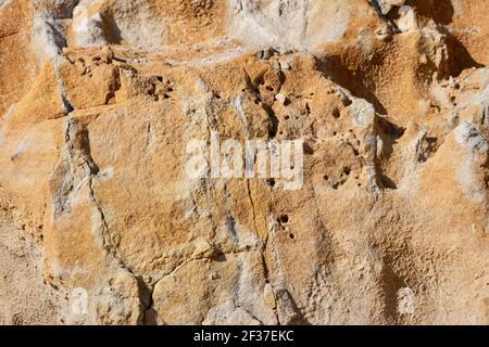 Sand Colored stone wall texture background Stock Photo