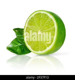 Half of fresh green lime with leaves isolated on white background. Stock Photo