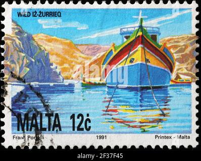 Typical Maltese boat on postage stamp Stock Photo