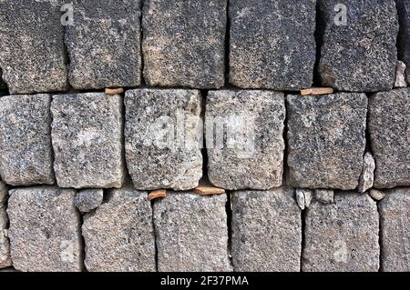 dry tuff wall, typical construction of southern Italy Stock Photo