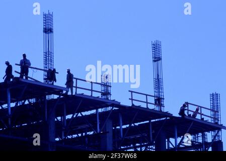 Construction workers on building site Stock Photo