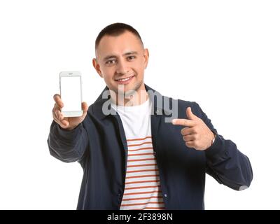 Handsome young man with mobile phone on white background Stock Photo