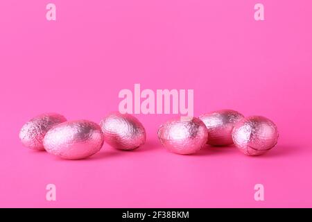 Beautiful chocolate Easter eggs on color background Stock Photo