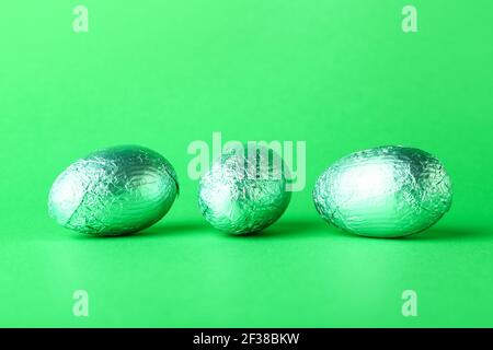Beautiful chocolate Easter eggs on color background Stock Photo