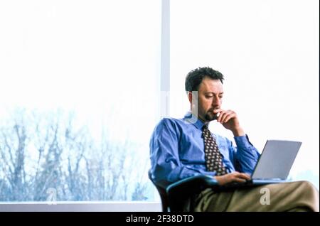 Businessman working on laptop. Stock Photo