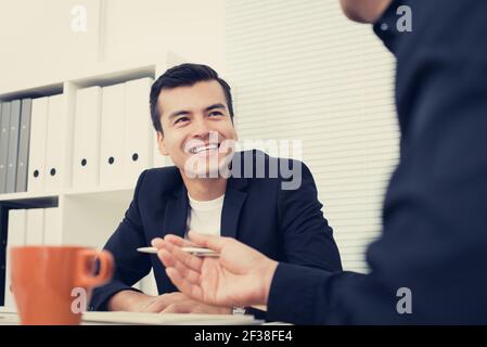 Smiling handsome businessman in the meeting Stock Photo