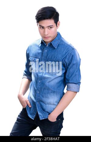 Portrait of handsome young Asian man in blue jean shirt - on white background Stock Photo