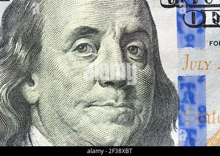 Close up of Benjamin Franklin face on 100 US dollar bill Stock Photo