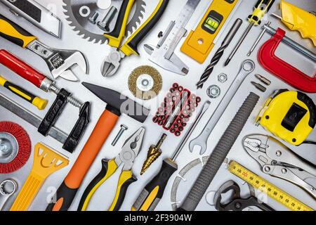 assorted work and home renovation tools. diagonal flat lay. concept industrial background Stock Photo