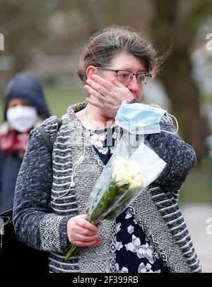 London, UK. 15th Mar, 2021. A woman weeps at the bandstand on Clapham Common to mourn for Sarah Everard in London, Britain, on March 15, 2021. A serving Metropolitan police officer on March 13 appeared in court in London after being charged with the kidnap and murder of a 33-year-old woman. Wayne Couzens, 48, was arrested after Sarah Everard, a marketing executive, went missing while walking home from a friend's apartment in south London on March 3. Credit: Xinhua/Alamy Live News Stock Photo