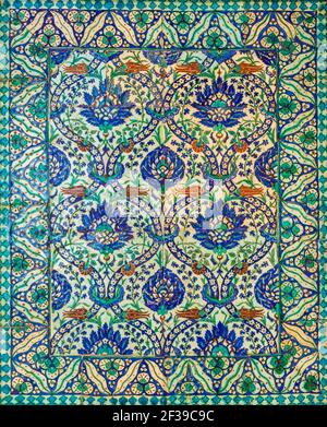 Wall decorated with traditional Ottoman era style glazed ceramic tiles from Iznik - Turkey - with floral ornamentations, Cairo, Egypt Stock Photo