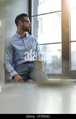 Getting distracted from work by looking outdoors Stock Photo