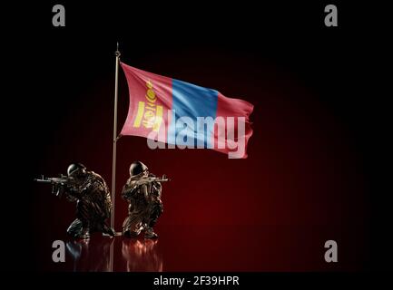 Concept of military conflict with soldier statues and waving national flag of Mongolia. Illustration of coup idea. Two guards defending the symbol Stock Photo