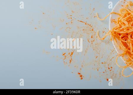 dirty stain from the tomato sauce on the table. isolated on blue background Stock Photo