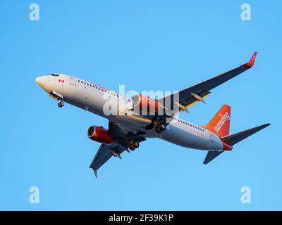 Richmond, British Columbia, Canada. 15th Mar, 2021. A Sunwing Airlines Boeing 737-800 jet (C-GBZS) landing at Vancouver International Airport. Credit: Bayne Stanley/ZUMA Wire/Alamy Live News Stock Photo